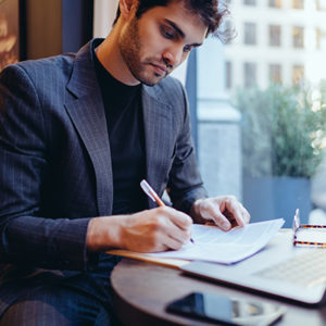 Man writing on page