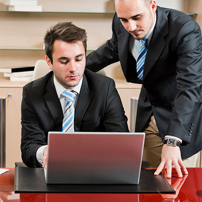 Two men looking at computer