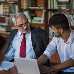 Men talking while working